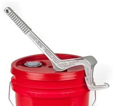 A red five-gallon bucket with a metal pail opener on the lid.
