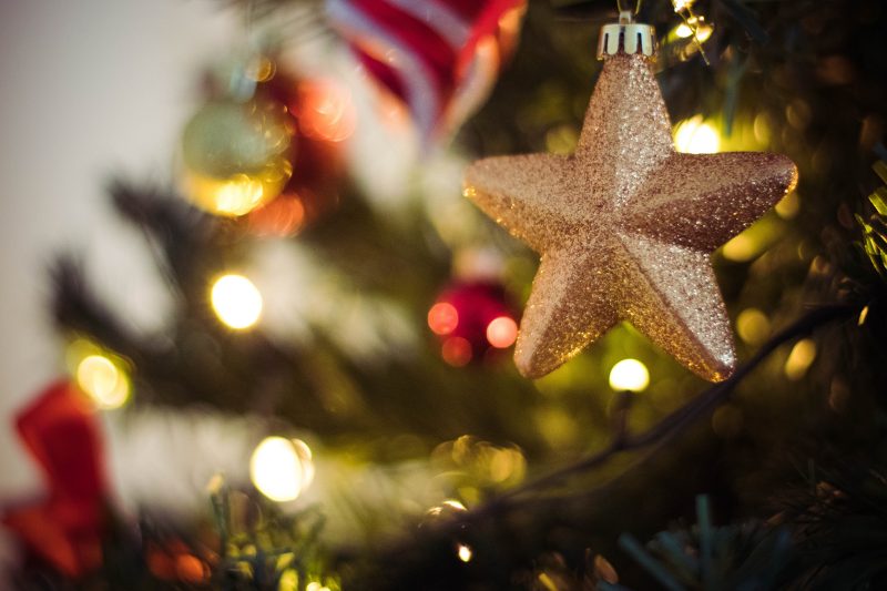 christmas tree with star ornament hanging