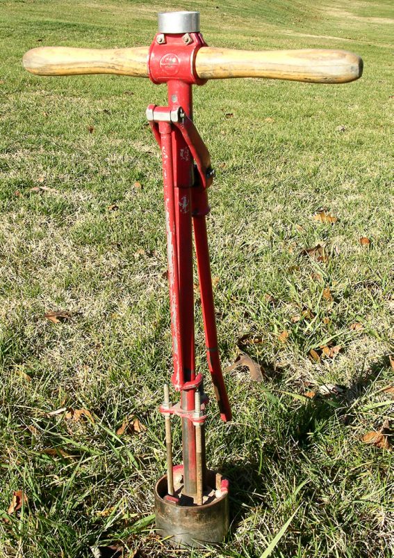 Bright red posthole digger
