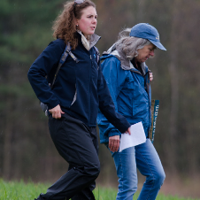 photo of two people walking together outdoor