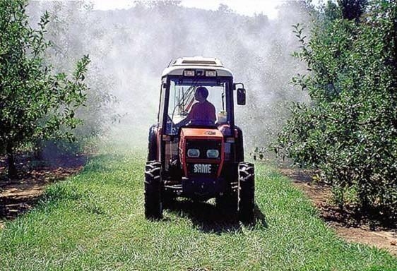 Figure 1. Photo shows an airblast sprayer in an orchard.