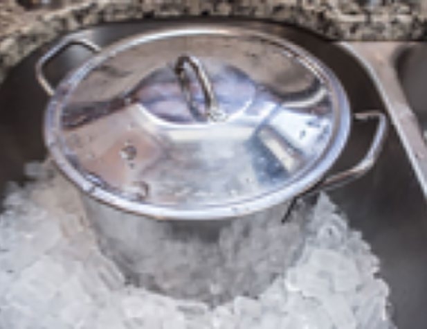 a photo of a pot on bunch of ice cubes