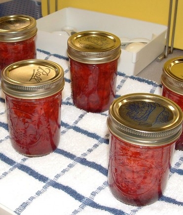 a photo of jams in canning jars 