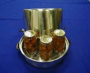 A steam canner with jars for processing.