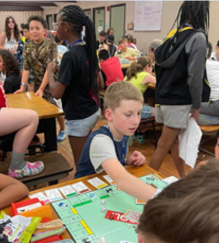 A group of kids playing board games.